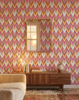 Rose Arrow pink and orange geometric wallpaper in a warm and inviting living room