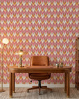 Rose Arrow pink and orange geometric wallpaper as a feature wall in a bright home office
