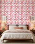 Rose Facet pink geometric peel and stick wallpaper adding character to a cozy bedroom