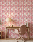 Rose Facet pink geometric peel and stick wallpaper as a feature wall in a bright home office