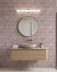 Rose Resist textured mauve abstract wallpaper creating ambiance in a serene bathroom