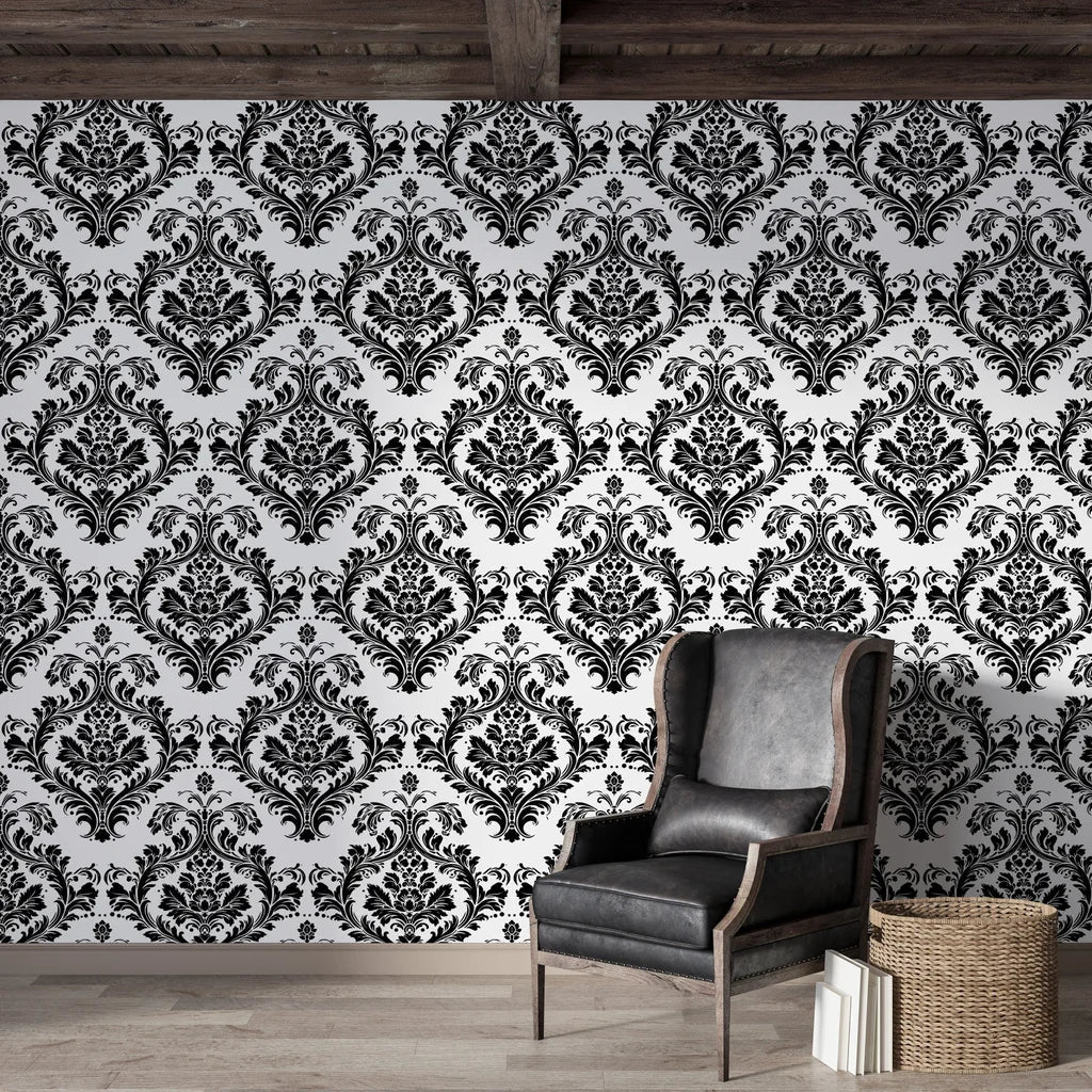 Rosette Haven damask wallpaper on living room wall with black leather chair and rustic wood beams