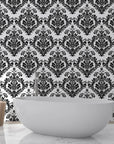 Black and white Rosette Haven damask wallpaper behind modern bathtub in elegant bathroom setting