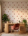 Ruby Streams ladybug stripe wallpaper as a feature wall in a bright home office