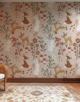 Woodland themed wallpaper covering a playroom wall with warm neutral colors and nature motifs