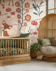 Children’s woodland wallpaper displayed on an interior wall with whimsical forest animals
