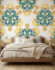 Saffron Bloom vibrant yellow and teal floral wallpaper in a warm and inviting living room
