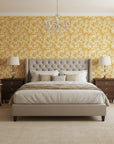 Saffron Hush warm gold chrysanthemum wallpaper adding character to a cozy bedroom