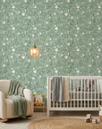 Sage Blossom serene green floral wallpaper adding character to a cozy bedroom