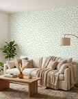 Sage Drop sage green polka dot wallpaper in a warm and inviting living room