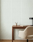 Sage Wave serene green lines wallpaper as a feature wall in a bright home office