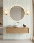 Sage Wave serene green lines wallpaper creating ambiance in a serene bathroom