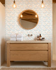 Sand & Sky Fret coastal geometric peel and stick wallpaper creating ambiance in a serene bathroom