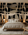 Sandy Strands fluid ribbon wallpaper adding character to a cozy bedroom