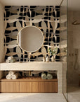Sandy Strands fluid ribbon wallpaper creating ambiance in a serene bathroom