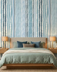 Sapphire Bead coastal blue stripe wallpaper adding character to a cozy bedroom