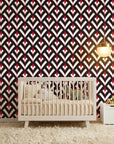 Scarlet Edge dramatic red and black geometric wallpaper as a feature wall in a bright home office