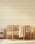 Scattered Gold neutral floral peel and stick wallpaper bringing warmth to a peaceful nursery