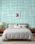 Sea Glass Grid teal abstract wallpaper adding character to a cozy bedroom