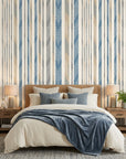 Seashore Dot blue and beige striped wallpaper adding character to a cozy bedroom