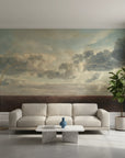 Shaded Grove cloudscape mural wallpaper in sage and cream tones on modern living room accent wall