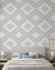 Shifting Current blue geometric peel and stick wallpaper adding character to a cozy bedroom