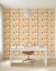 Sienna Drift warm terracotta autumn leaf wallpaper as a feature wall in a bright home office