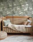 Winter Fawn Meadow wallpaper installed in a nursery featuring woodland deer and soft neutral decor