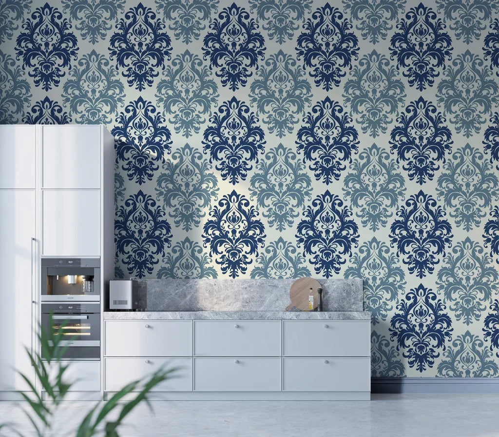Navy and sage damask Silent Bouquet wallpaper on modern kitchen accent wall with white cabinetry