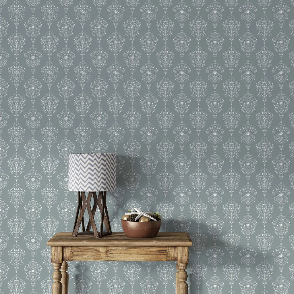 Sage green Silent Spring damask wallpaper with white ornate medallions in styled living room setting