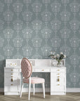 Silent Spring removable wallpaper in sage green with white damask medallions behind elegant vanity desk
