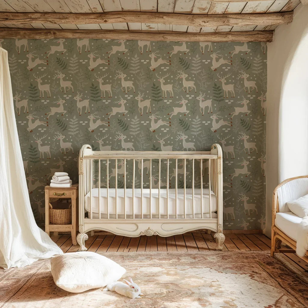 Removable nursery wallpaper featuring a repeat design of deer and coniferous trees in a soft earth-toned green - Silent Woods
