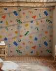 Playful abstract wallpaper used on a playroom accent wall, bringing energy and creativity through scattered colorful icons.