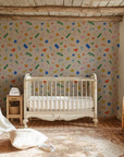 Modern peel and stick wall covering with multi-colored geometric silhouettes over a soft beige background - Silly Shapes