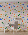 Neutral beige backdrop featuring vibrant abstract geometric paper-cutout patterns on self-adhesive wallpaper - Silly Shapes