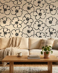 Sketch Anemone artistic floral wallpaper in a warm and inviting living room