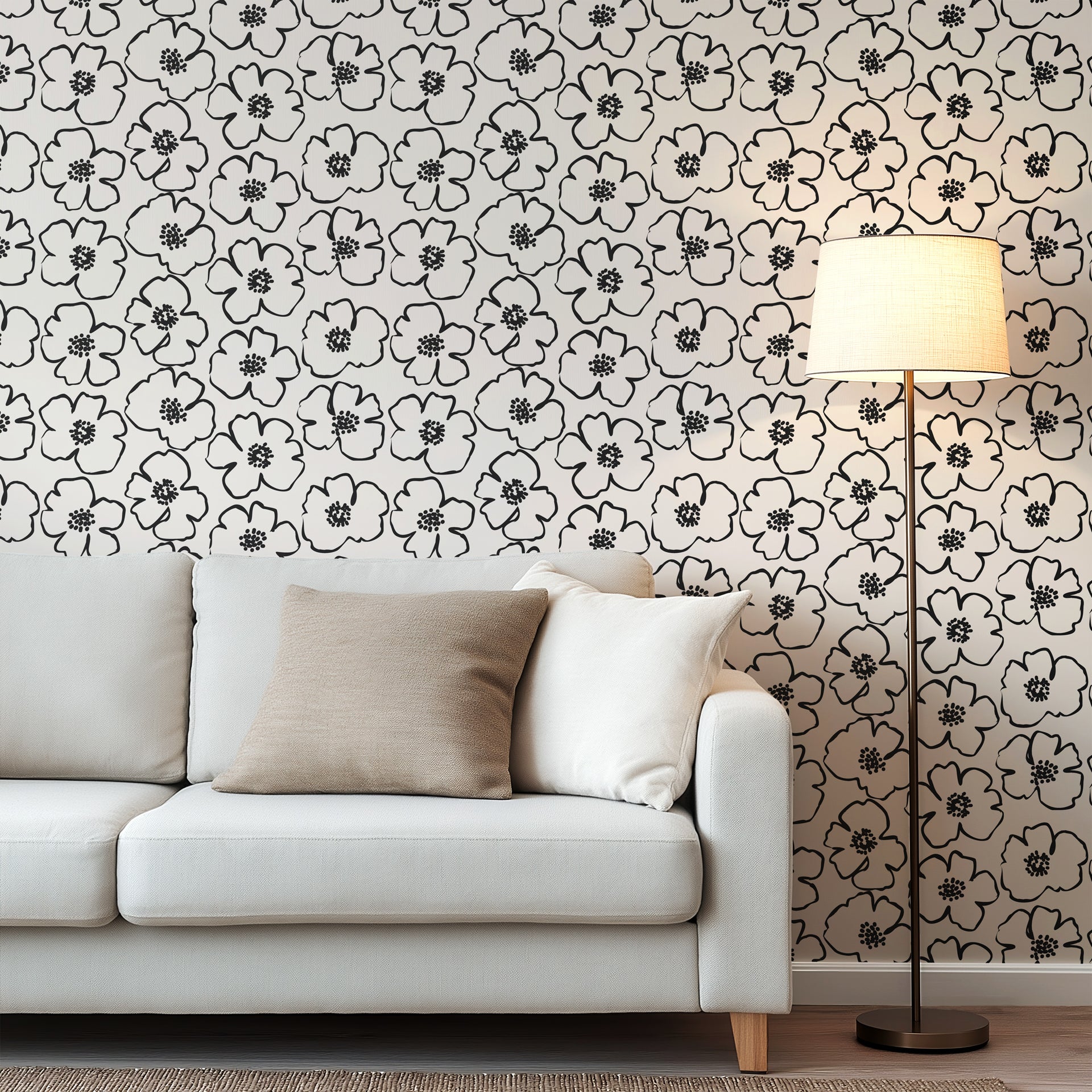 Minimalist black and ivory floral wallpaper with bold hand drawn flower outlines and clustered dotted centers.