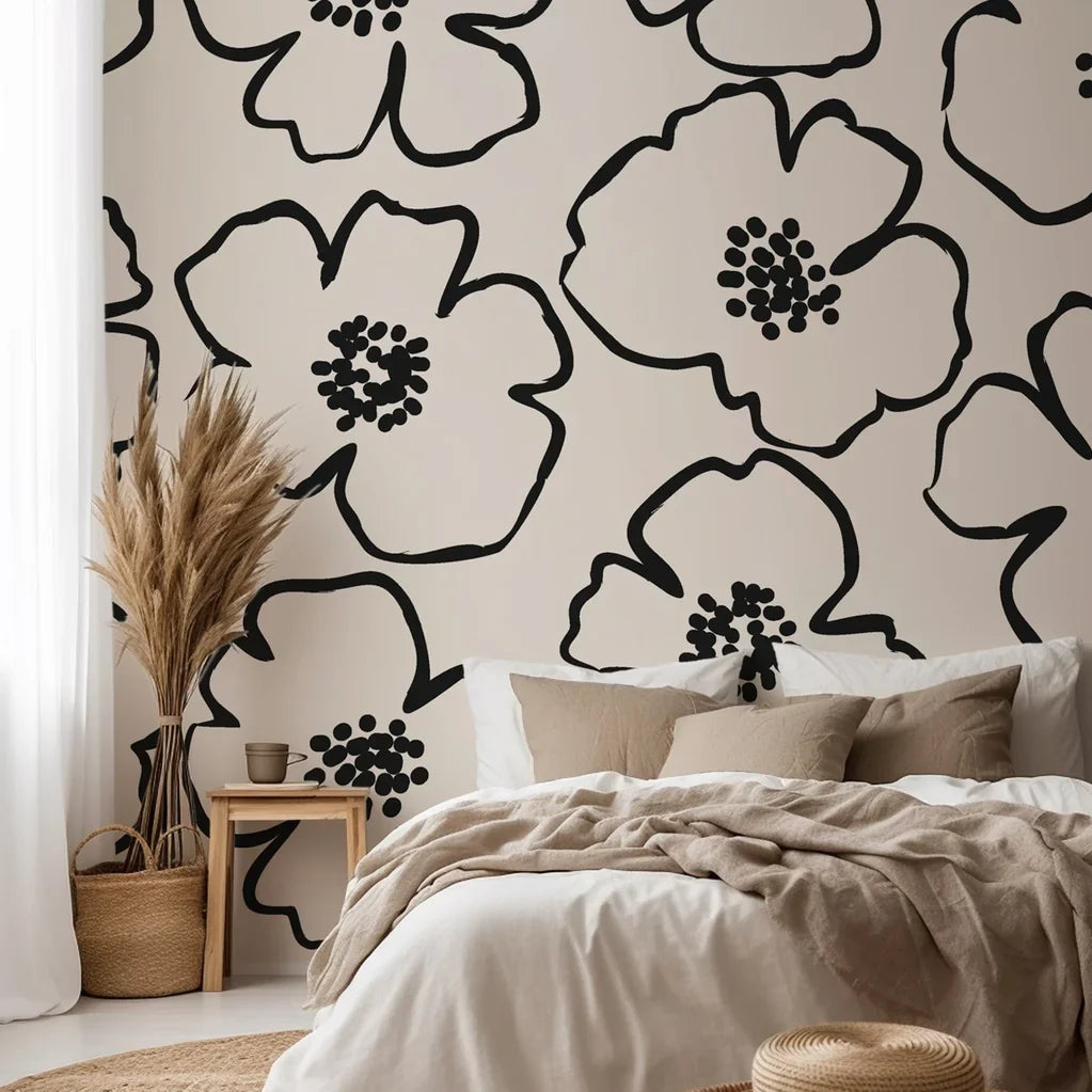 Wallpaper design in ivory and black, showing flowers defined by thick, hand-sketched lines and centralized clusters of dots