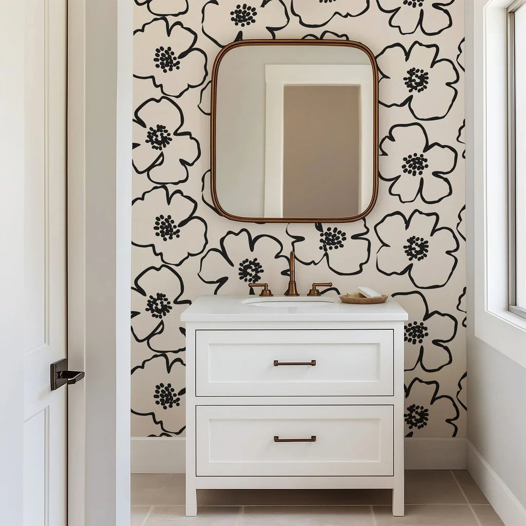 Wallpaper in an ivory and deep black colorway, exhibiting large, simply styled blossoms with pronounced outlines and small, aggregated dots in the middle