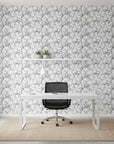 Sketched Silence black and white line art leaf wallpaper as a feature wall in a bright home office