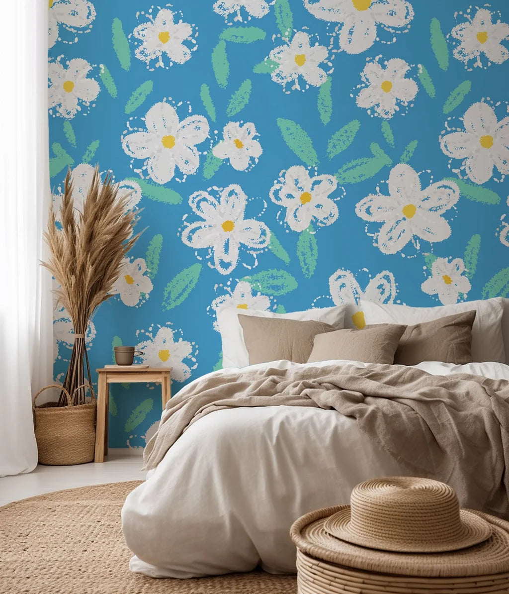 A white, chalk-style daisy pattern printed on deep blue wallpaper
