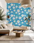 Sky-blue wall covering with a white, hand-drawn chalk effect daisy design