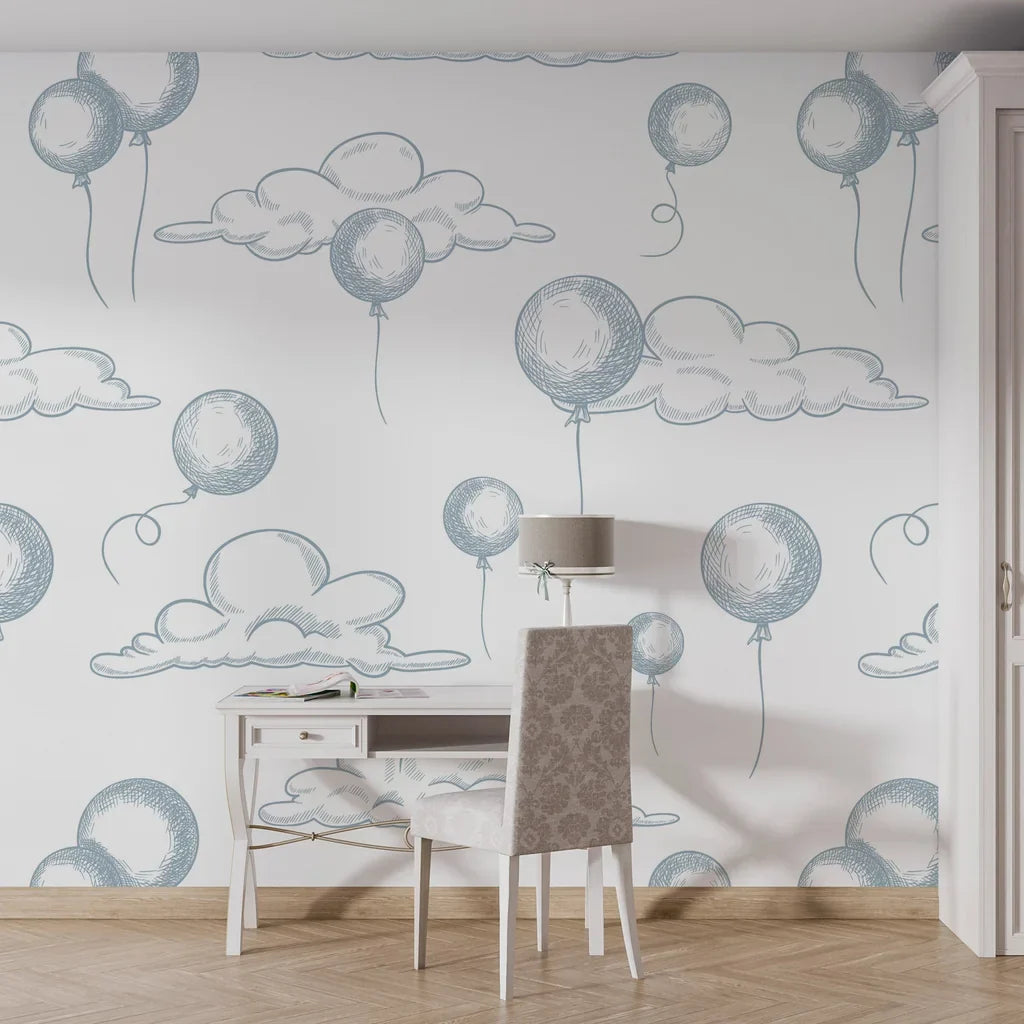 Blue and white hand-sketched clouds and balloons adorn this easy-to-apply peel and stick wallpaper - Sky Dreams