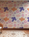 Cute illustrated bird wallpaper covering a playroom wall, using gentle pastel colors and friendly shapes to create a warm, imaginative space.