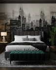 Smoke & Shadow wallpaper featuring monochrome cityscape with illuminated skyscrapers on modern bedroom accent wall