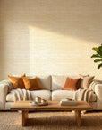 Soft Citrus textured gold abstract wallpaper in a warm and inviting living room