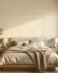 Soft Citrus textured gold abstract wallpaper adding character to a cozy bedroom