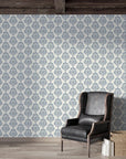 Blue and cream damask Soft Petal Rhapsody wallpaper in rustic living room with leather chair