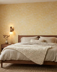 Solar Drift organic yellow wallpaper adding character to a cozy bedroom