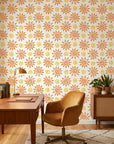 Vibrant orange folk art sun swirl peel and stick wallpaper - Solstice Bloom as a feature wall in an office